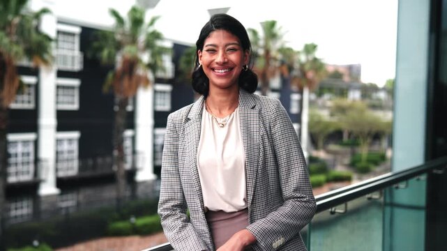 Realtor, face or woman on balcony with laugh, commercial career or pride in real estate profession. Happy, portrait or broker outdoor with confidence, leasing agent or about us in property management
