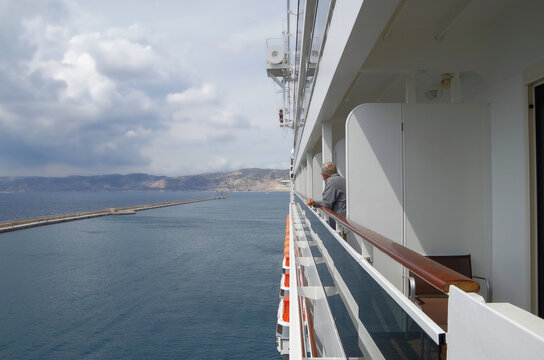 Deck chairs or sun loungers with table on balcony terrace patio promenade boat deck of classic luxury cruise ship cruiseship ocean liner with amazing oceanview