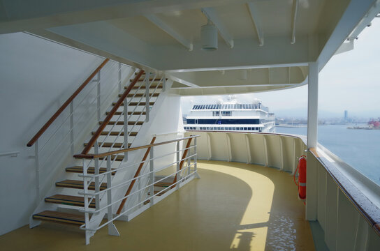 Deck chairs or sun loungers with table on balcony terrace patio promenade boat deck of classic luxury cruise ship cruiseship ocean liner with amazing oceanview