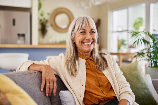 Smiling healthy mature woman looking away