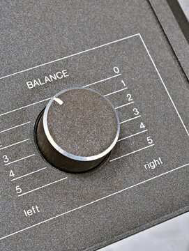 Angled view of audio balance rotary knob on front panel
