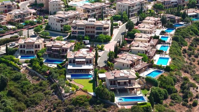Drone View of Aphrodite Hills Luxury Villas With Swimming Pools, Cyprus. Hilltop Mansions in Upscale Community