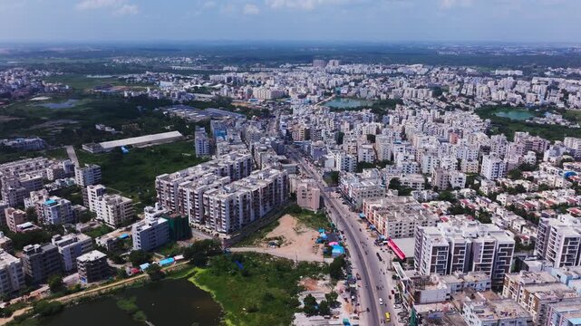 Residential buildings with apartments, villas, greenery and roadway at bachupally, mallampet, hyderabad, telangana, india. day time, static shot, drone shot, 4k.