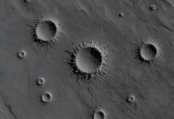 Fototapeta premium Space exploration and planetary science, aerial view of impact craters on a barren moon or planet surface with rocky terrain and geological formations