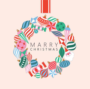 Christmas wreath composed of large shiny glass ornaments toys and decorative baubles drawing on beige background