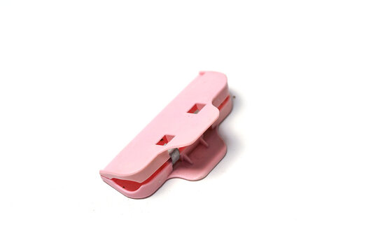 pink plastic food bag sealing clip displayed against a clean white background