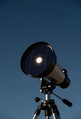 Fototapeta premium Renewable energy innovation and space exploration, telescope with solar panel lens filter capturing sunlight against a clear blue sky for green technology