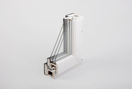 White and black pvc window profile cross section sample showing internal chambers and triple glazing