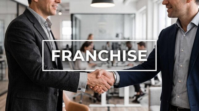 Businessmen shaking hands to finalize a successful partnership agreement and corporate franchise expansion inside a bright modern office building with colleagues working behind.