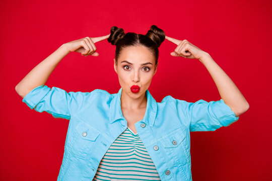 Pretty lady indicating hands on new hairstyle sending kiss stylist wear casual outfit isolated red background