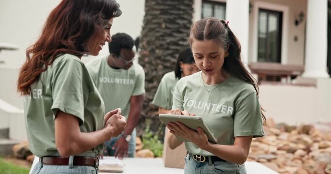 Smile, woman and volunteer outdoor with handshake, welcome and partnership for community service. Happy, team and shaking hands at event with tablet, introduction and agreement for charity enrollment