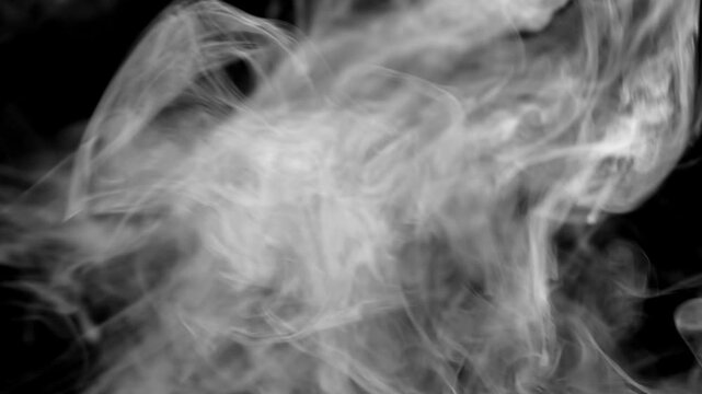 White, natural steam or smoke rising across the entire width of the screen, as if from a fire, a blaze, or a boiling dish.