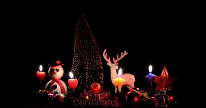 In the center, there is a snowman figure, a white reindeer figure, a mini gold Christmas tree, a decorative star, and the inscription "Merry Christmas".