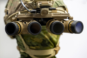 Fototapeta premium Military night vision goggles mounted on tactical combat helmet. Special forces panoramic four lens optical device shown in close frontal view.