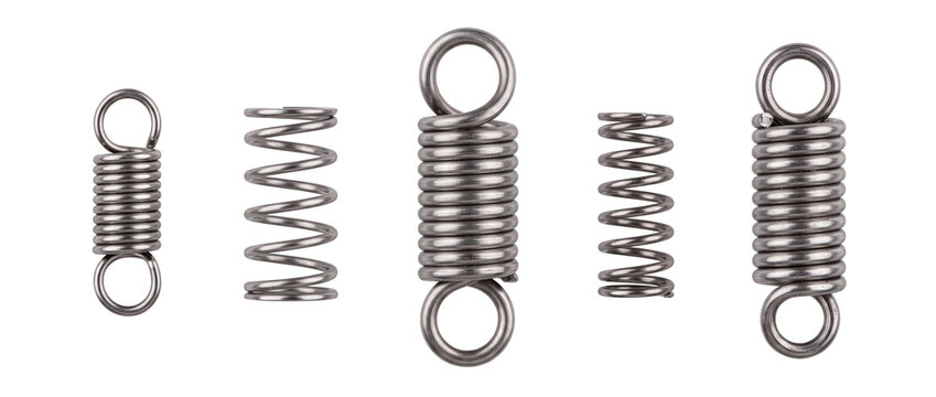 Metal spring set coiled steel tension compression springs lined up on black background for engineering, mechanical industrial hardware component, elastic flexibility, spare parts isolated design.