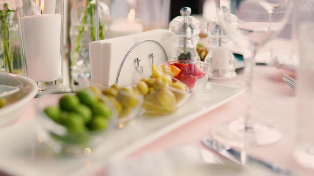 Catering service on banquet table with canape snacks in restaurant or hotel. Decorated food set on birthday, wedding celebration or business conference event