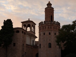 Historic bell tower and brick turrets in a European town © Natallia