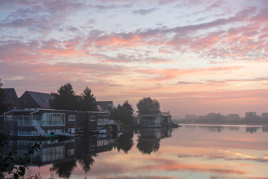 A tranquil, foggy dawn at the lake in Meerstad, Groningen.