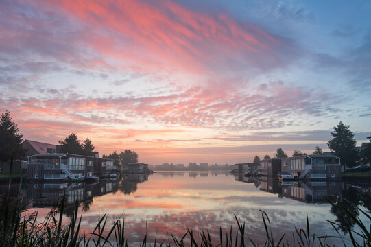 A tranquil, foggy dawn at the lake in Meerstad, Groningen.