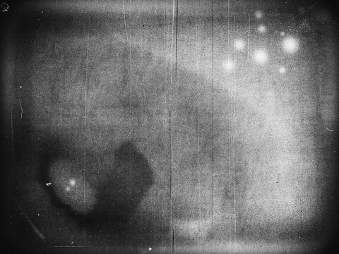 Abstract grainy black and white film texture with light leaks and dust scratches film grain cinematic effect scratched surface noise texture dust particles analog photo