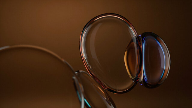 Macro shot of round liquid oil bubbles floating in dark brown liquid medium