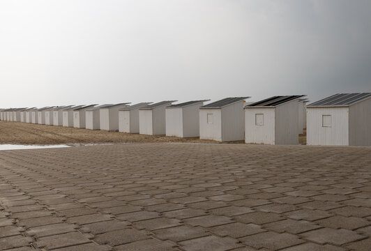 A row of beach cabin huts or strandcabine on the beach in Ostend, Belgium, Europe