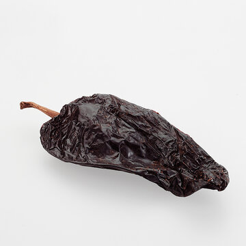 Dried Ancho Chile pepper isolated on white background