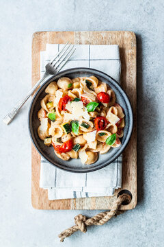 Summer orecchiette pasta with tomatoes and courgettes