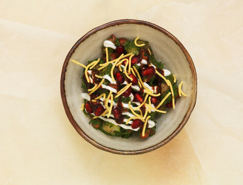 Aloo Chaat with fried potato cubes and chutney in a bowl