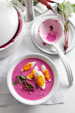 Beetroot cold soup served with boiled egg and Beetroot leaves