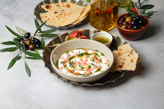 Yogurt labneh goats milk dip with taftan bread and pomegranate