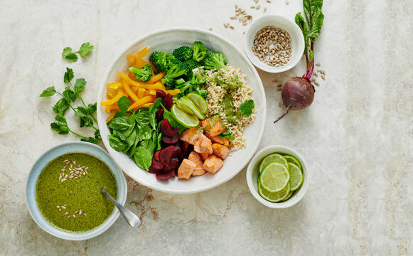 Roasted salmon bowl with rice and vegetables