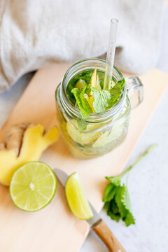 Ginger lemonade with mint and lime in glass jar
