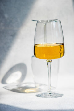 Georgian white dry wine in glass on studio surface