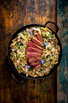 Roast beef with fusilli noodles and button mushrooms