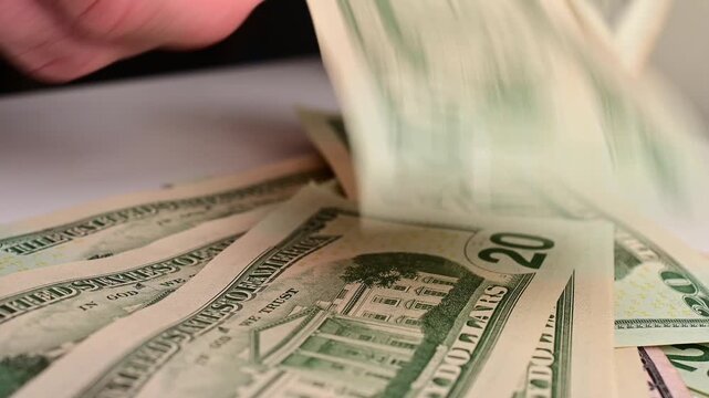 Stock of hundred dollars bills bokeh macro close up, texture, in and out of focus, abstract money finances, studio selective focus real time video	