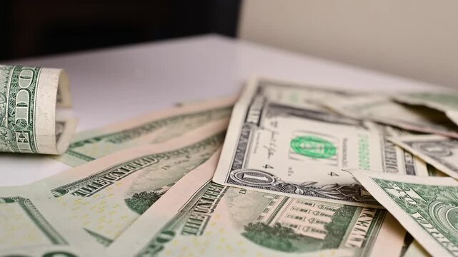 Stock of hundred dollars bills bokeh macro close up, texture, in and out of focus, abstract money finances, studio selective focus real time video	