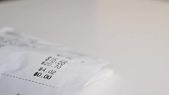 Receipt close up, paying, being, Macro close up moving shot paper texture hundred dollar bills background, money, finances, stock market background, b roll video