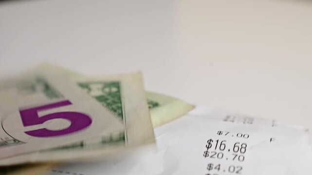 Receipt close up, paying, being, Macro close up moving shot paper texture hundred dollar bills background, money, finances, stock market background, b roll video