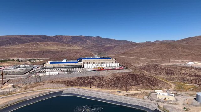Aerial view of a data center construction site along the artificial lake