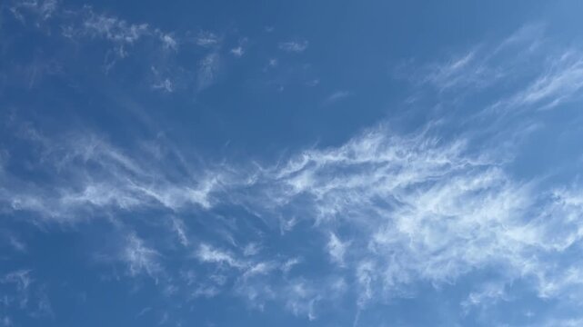 Cirrus clouds in blue sky.