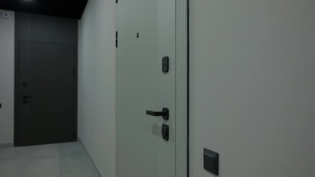 Modern apartment entrance doors in residential building corridor