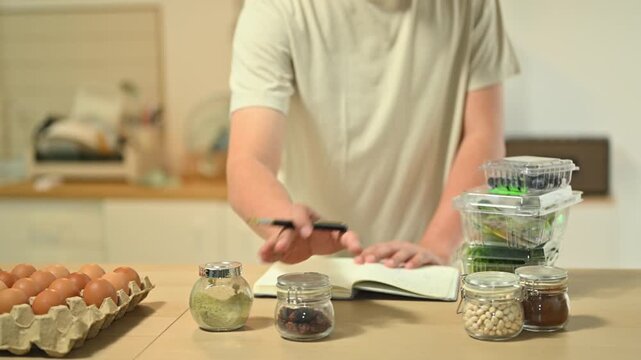Closeup Man Checking Nutrition Label on Packaged Bread in Kitchen