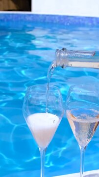 Champagne by the pool. Selective focus.