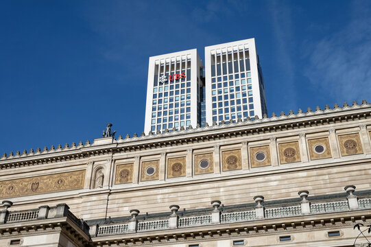Frankfurt, Germany October 4 2026: Contrast of historic Alte Oper facade and modern Opernturm skyscraper with UBS logo under blue sky in Frankfurt