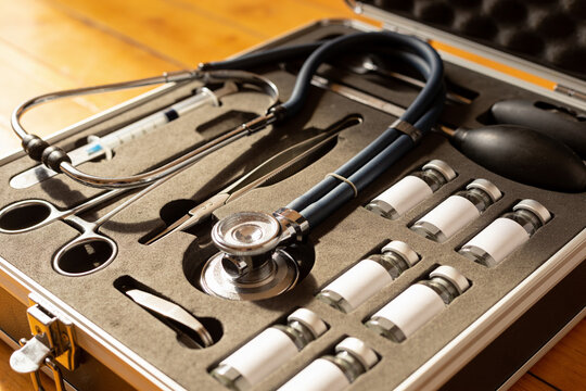 Open portable veterinary kit on a domestic floor