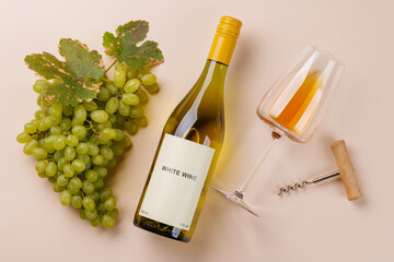 Naklejka premium Wine glass bottle and green grapes - elegant flat lay
