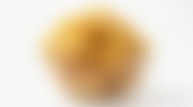 Blurred golden yellow shape against a white background presents an indistinct soft focus abstract form amorphous blurry colorfield diffusion formless goldenrod gradient