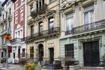 Old New York City apartment buildings with ornate decorative stonework © Spiroview Inc.
