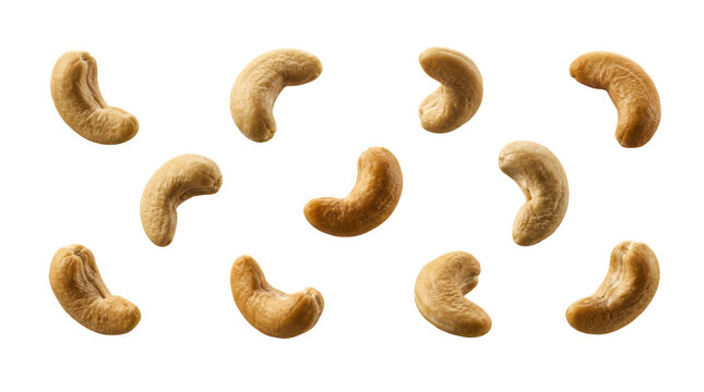 Group of roasted cashew nuts scattered on a flat surface